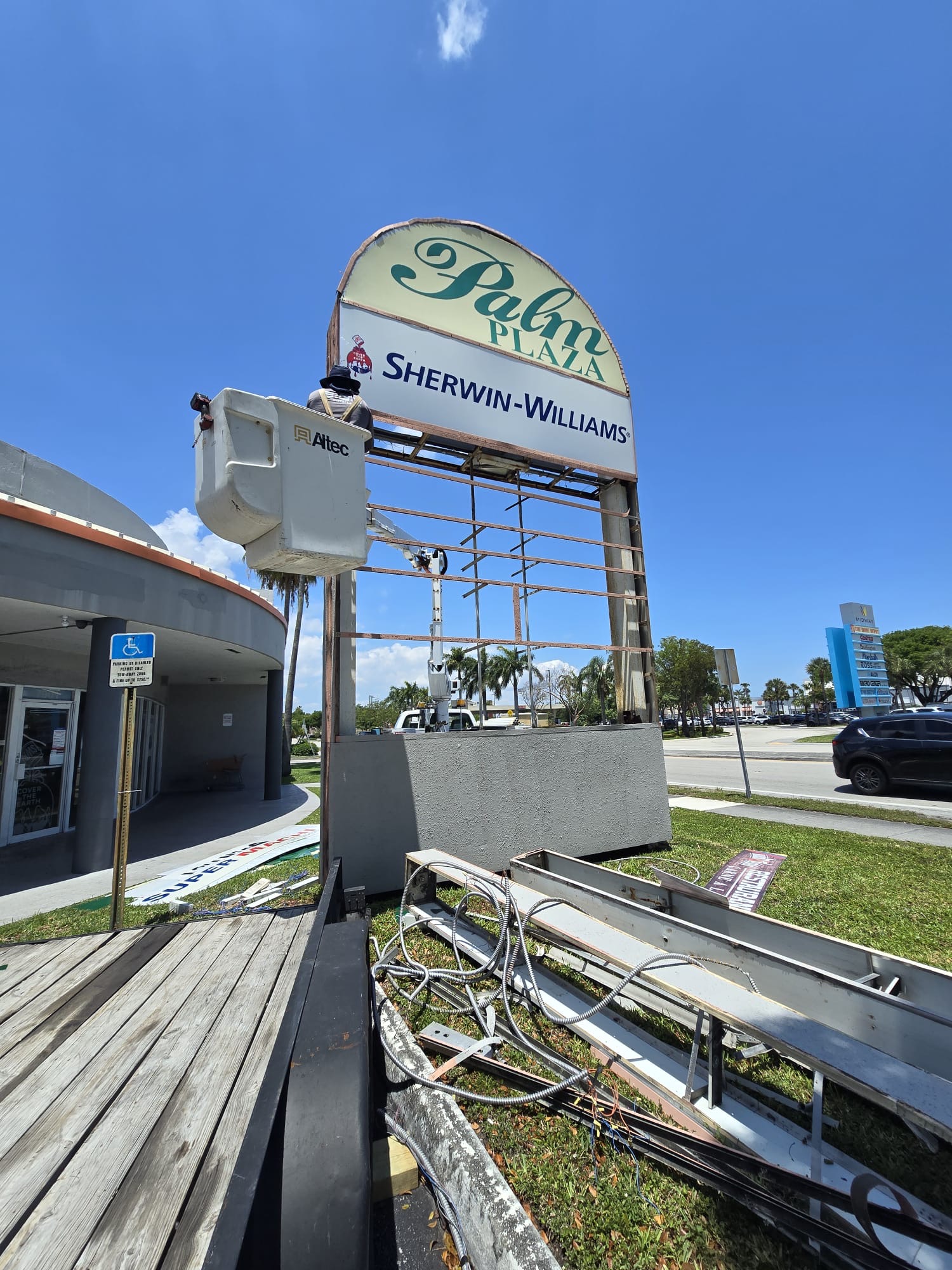 Palm Plaza sign during teardown and cabinet removal by King Signs Miami
